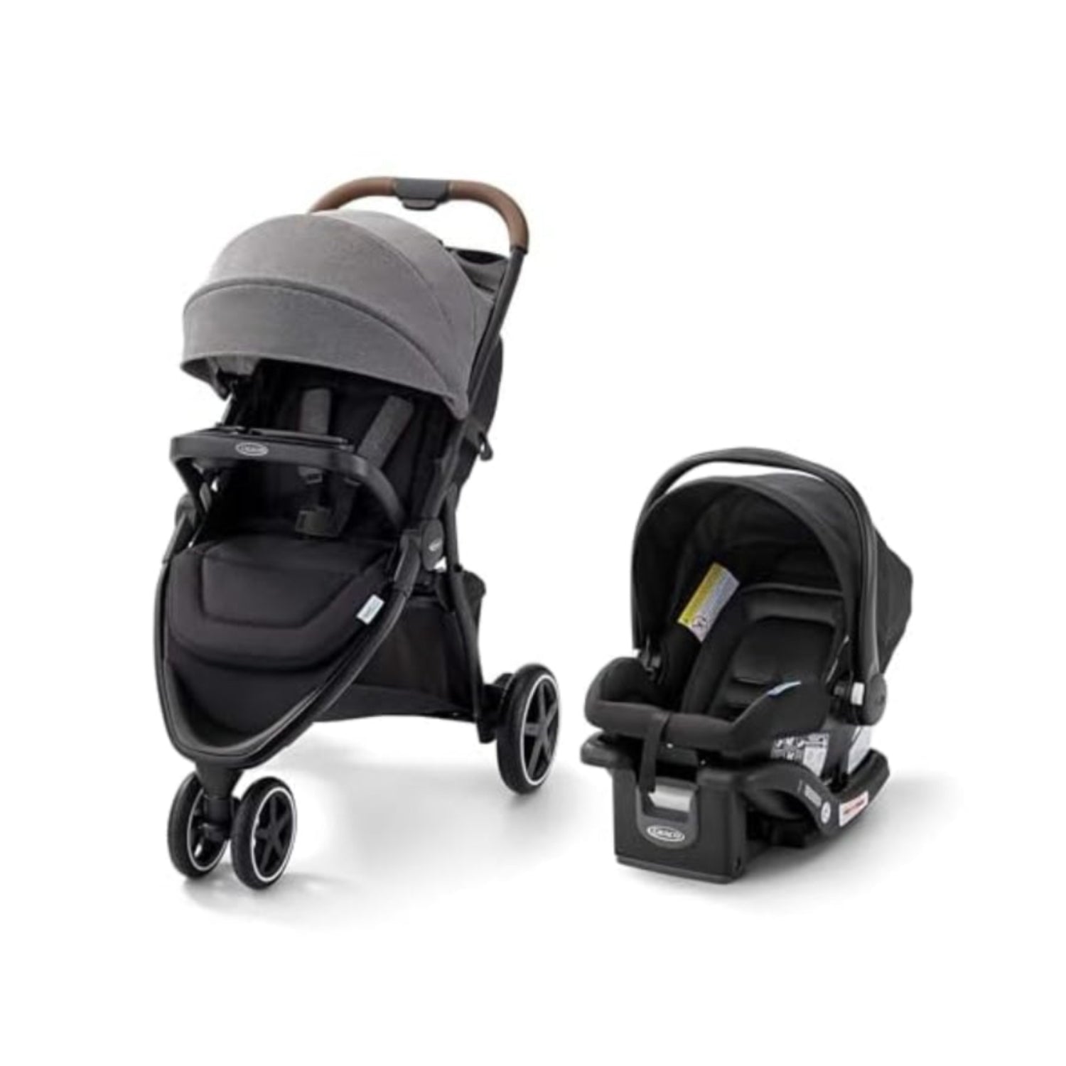Coche de bebé Graco gris, vista frontal con asiento de seguridad incluido